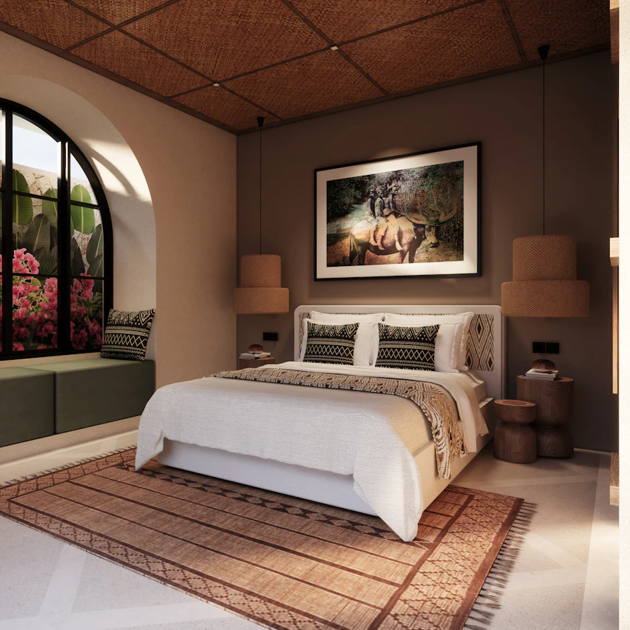 A bedroom with an arched window, woven rug and framed print