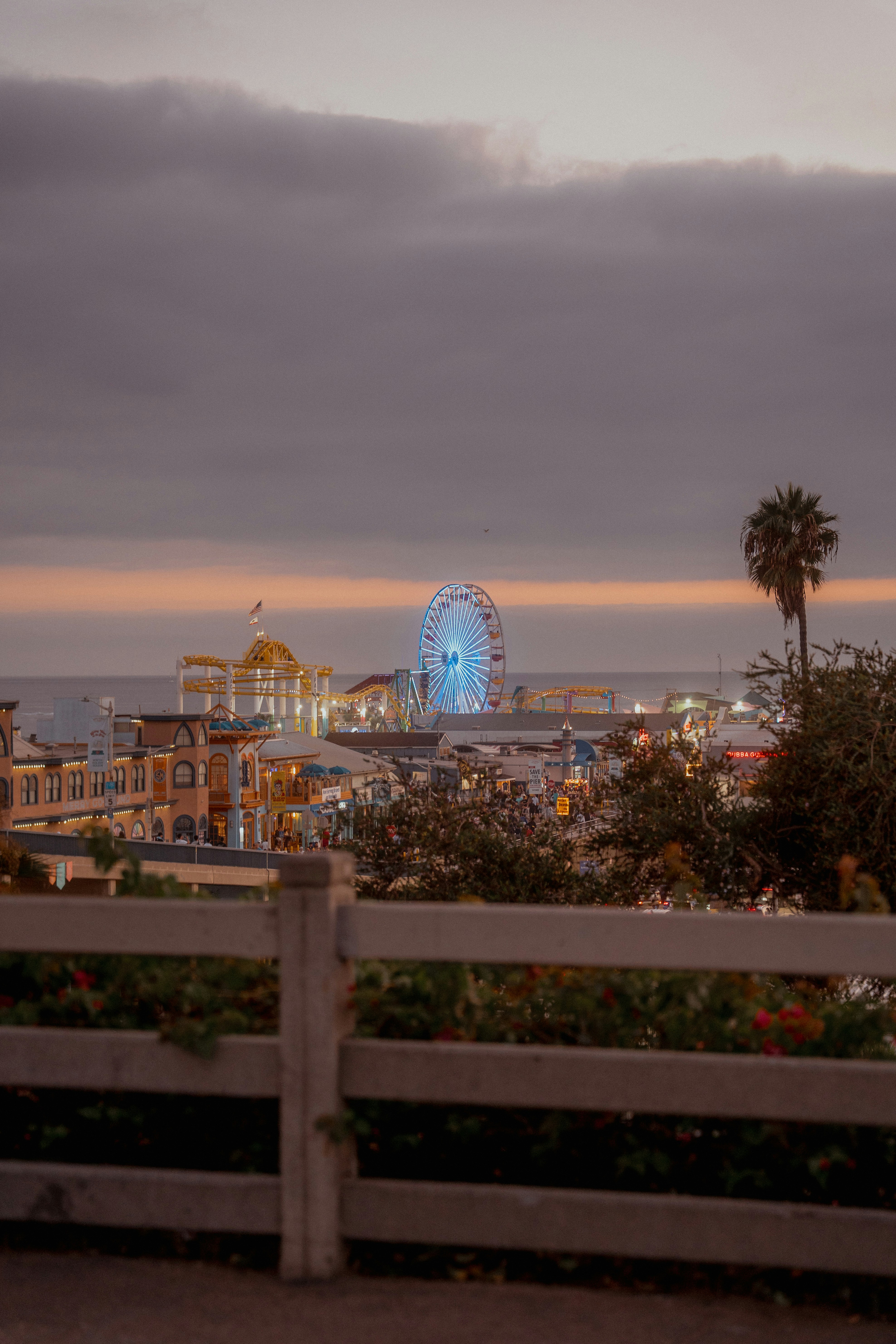 Amusement park with ferris wheel at dusk
