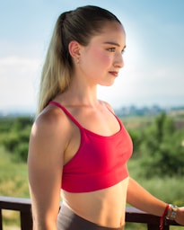 Young woman in athletic wear looking out