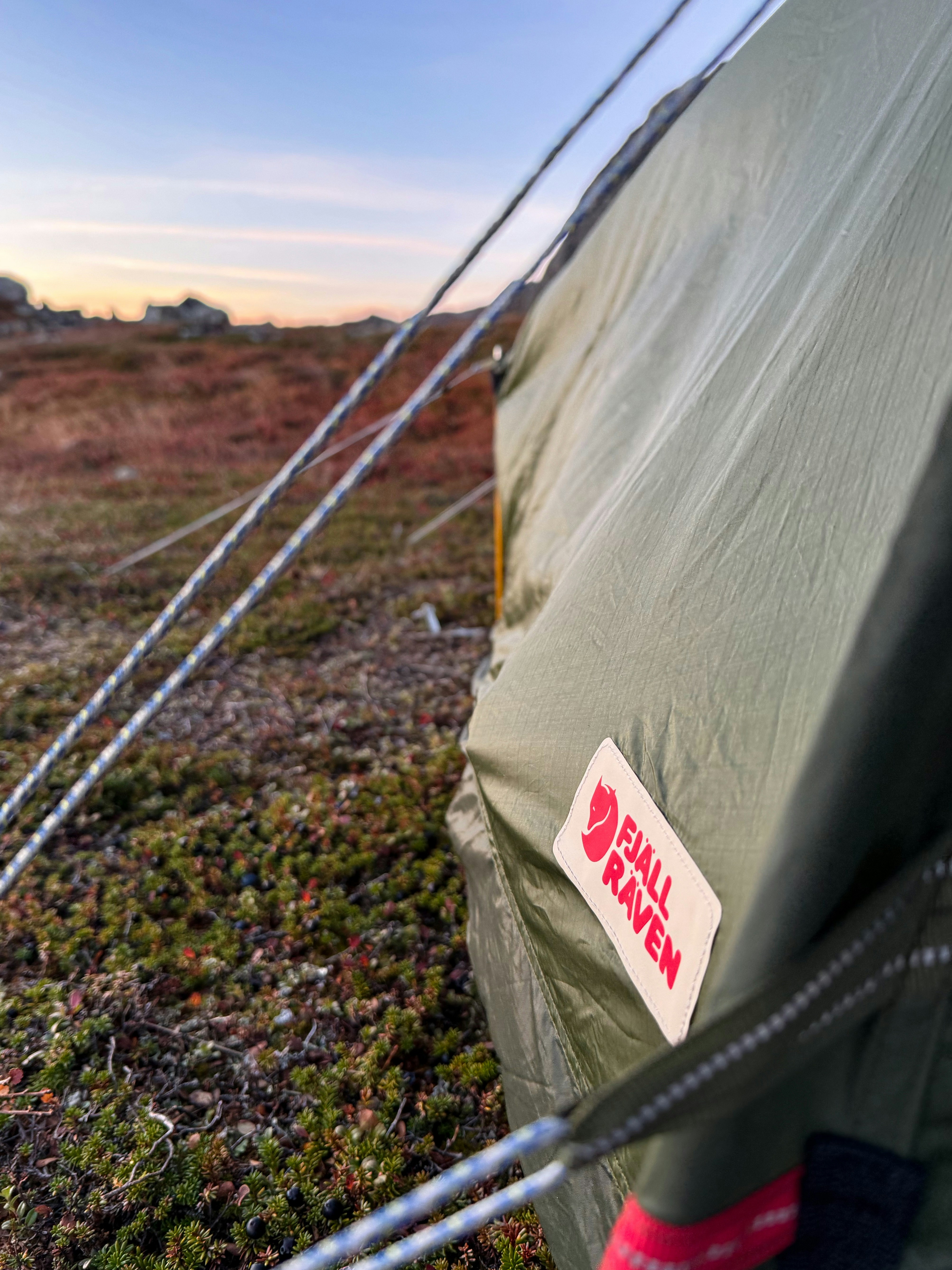 camping tent sunset view, ilustrasi artikel Stay Fresh Outdoors: Your Guide to Portable Showers for Camping 5