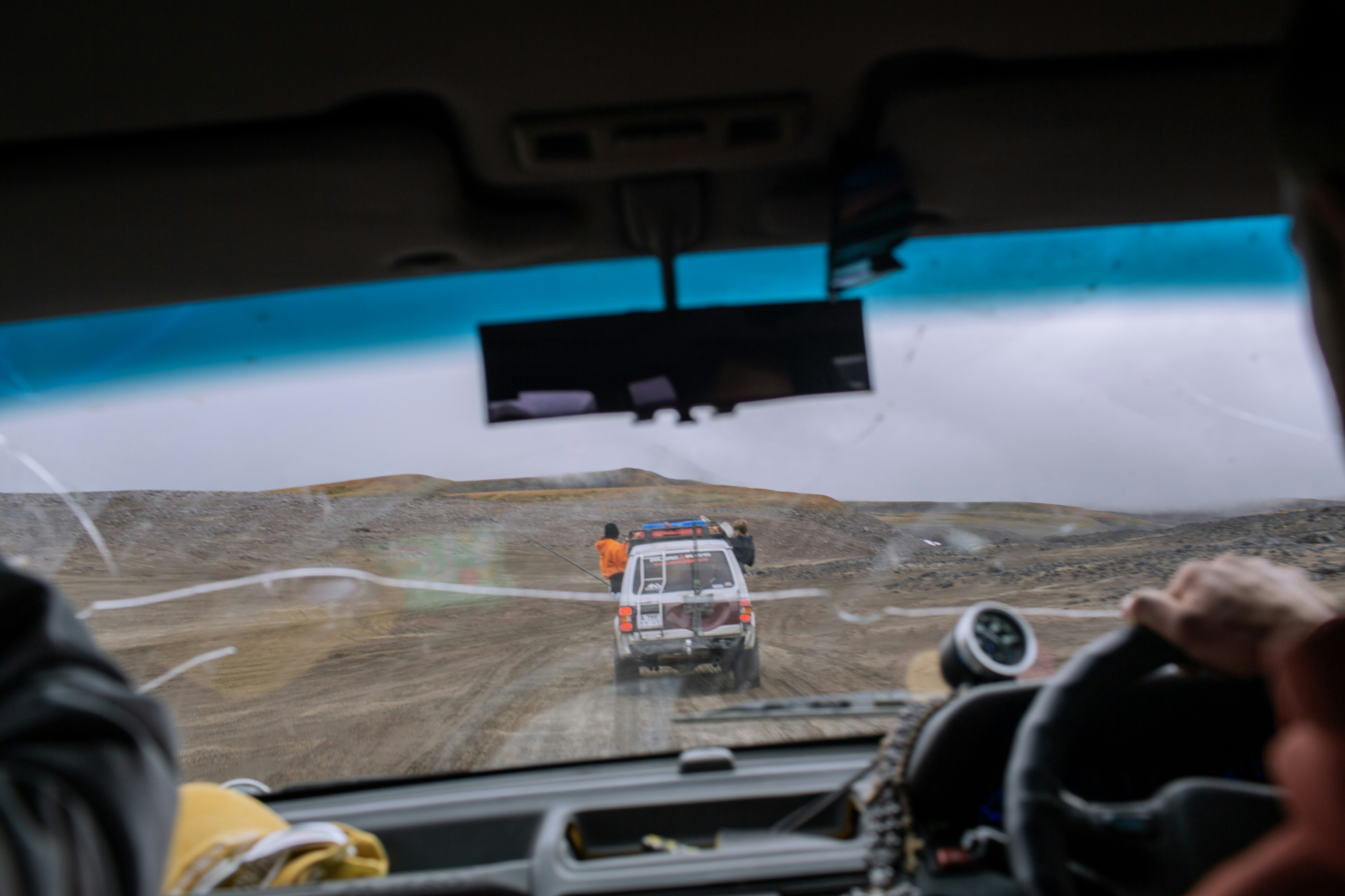 Four wheel drive vehicles on a muddy track