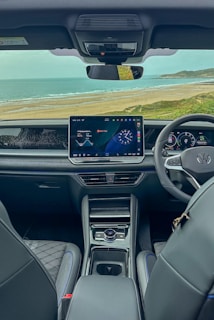 Car interior with ocean view through windshield