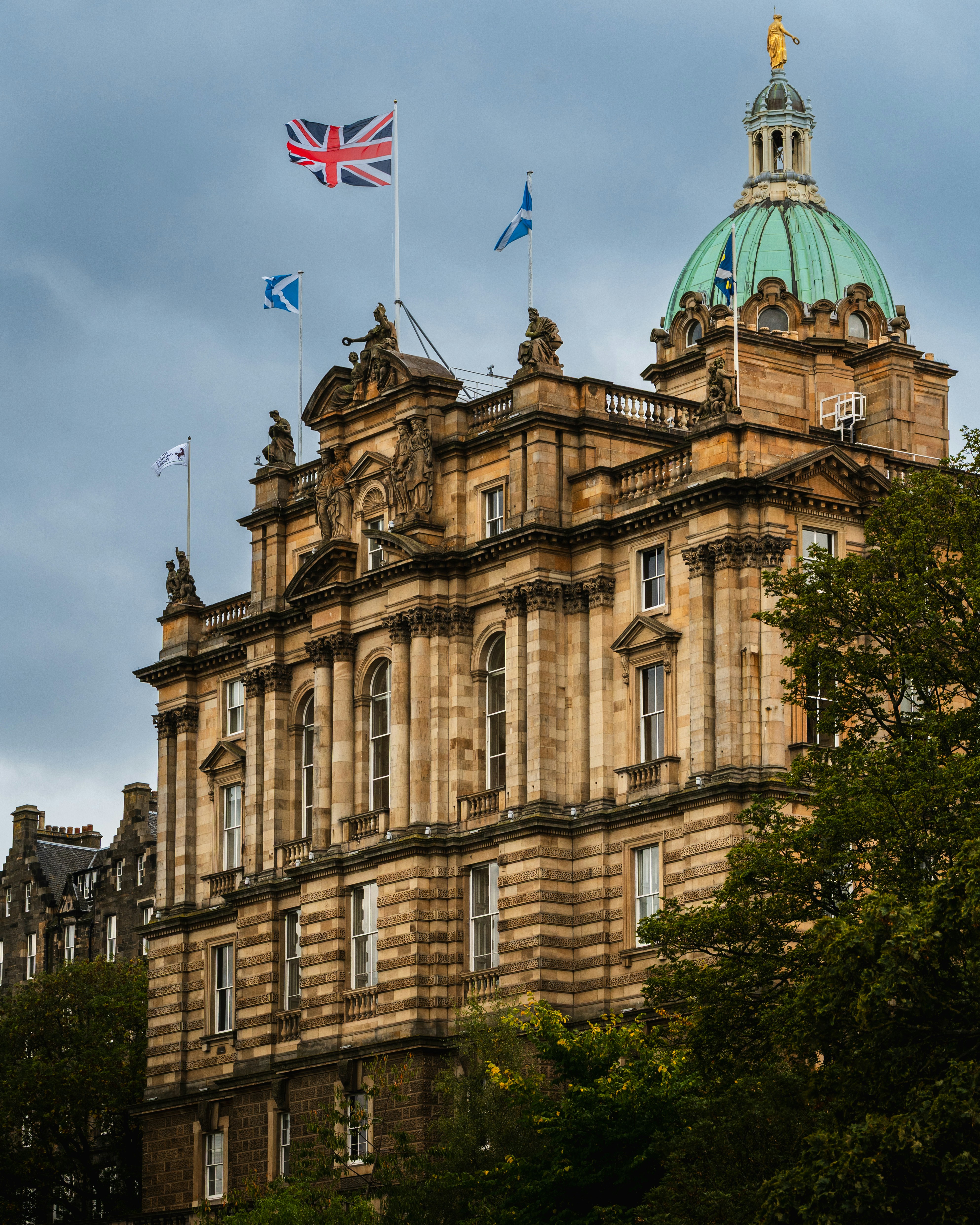Ornate building with union jack flag and dome.