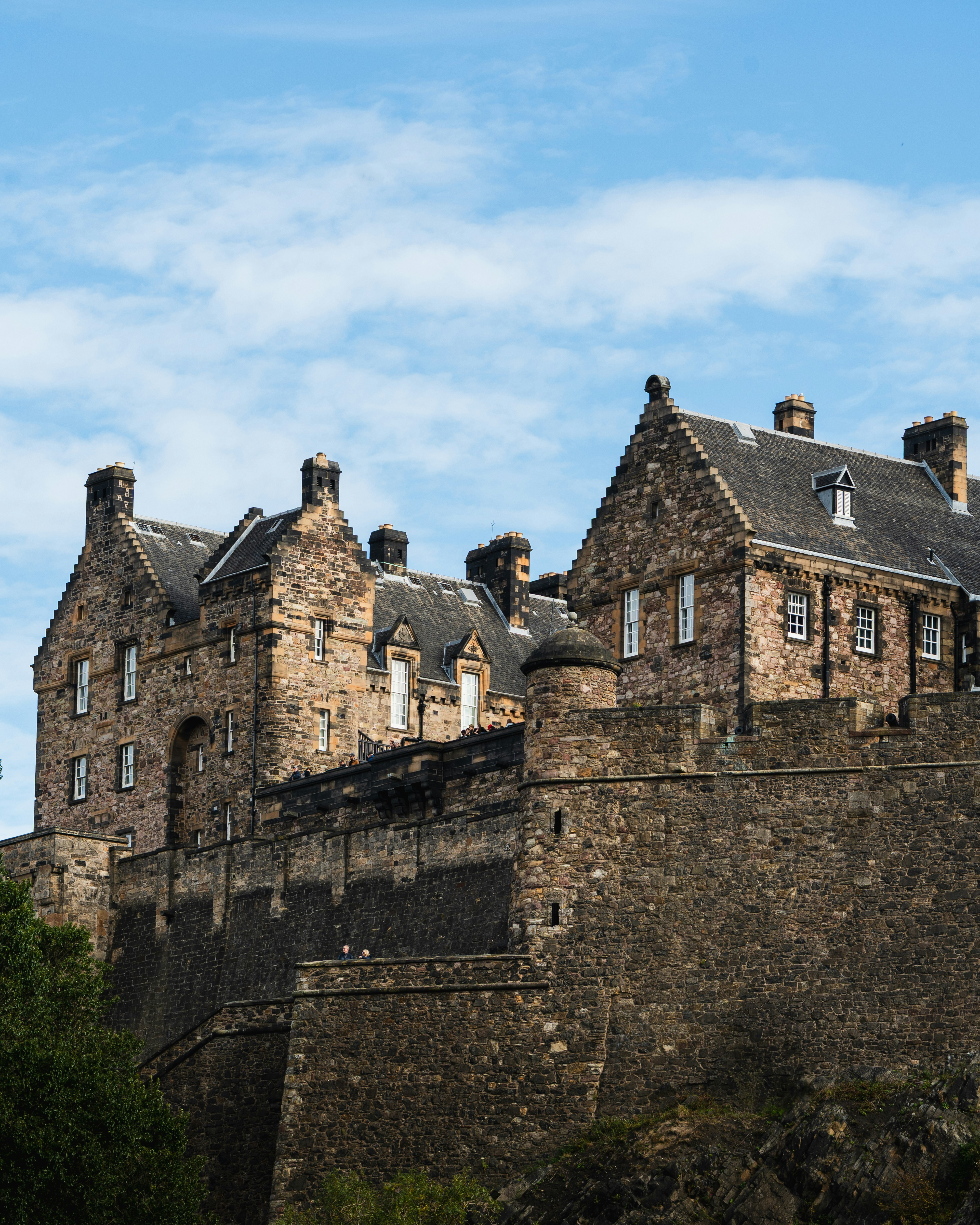 Historic stone castle perched on a rocky outcrop.