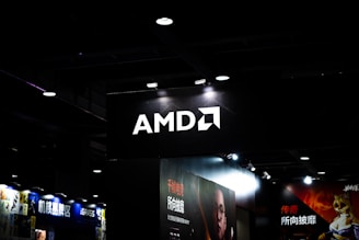 Amd logo illuminated on a dark ceiling