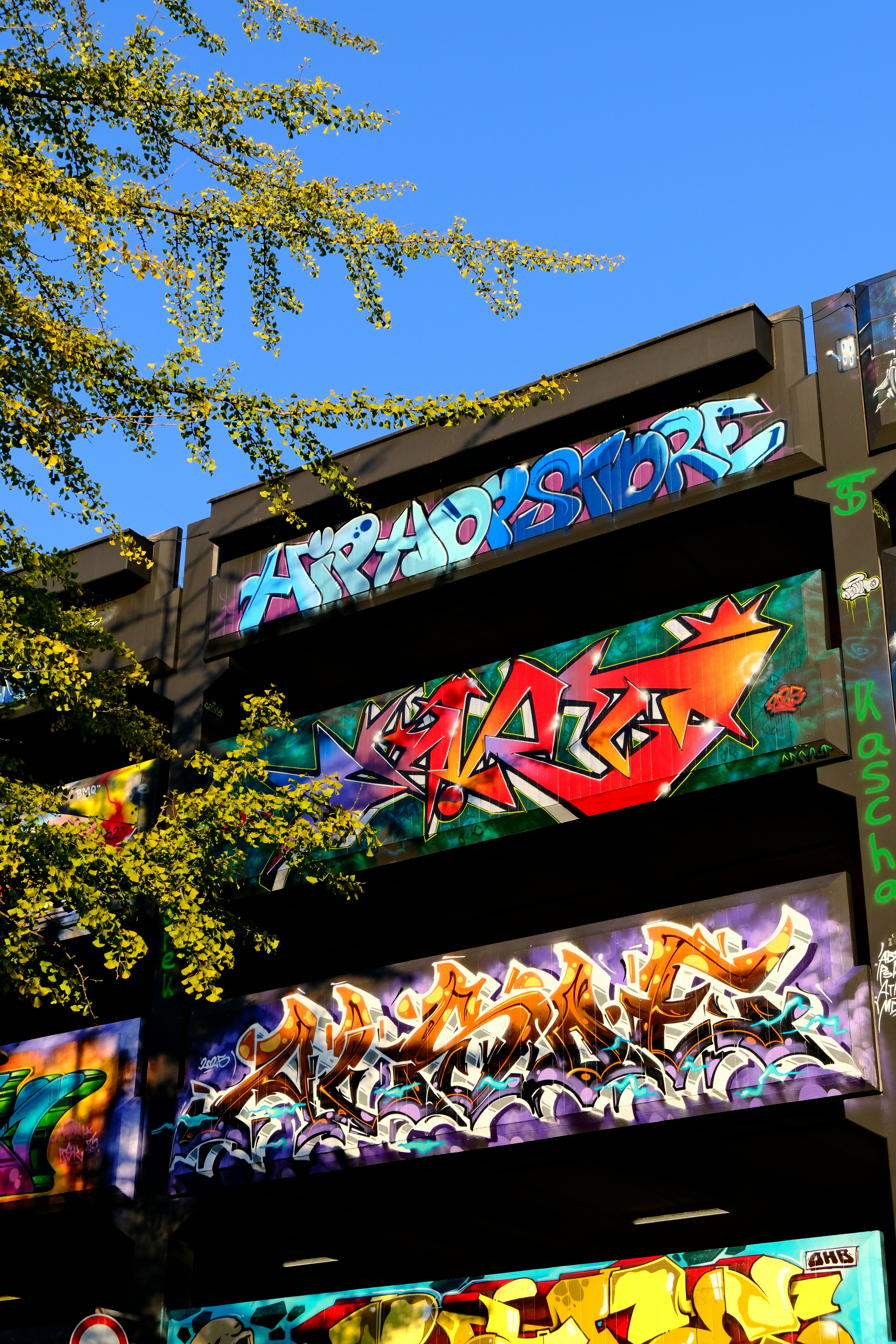 Colorful graffiti art on a building wall outdoors.