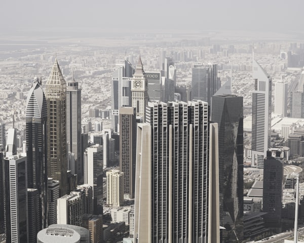 Modern Dubai skyscrapers fade into haze above the city's financial district.