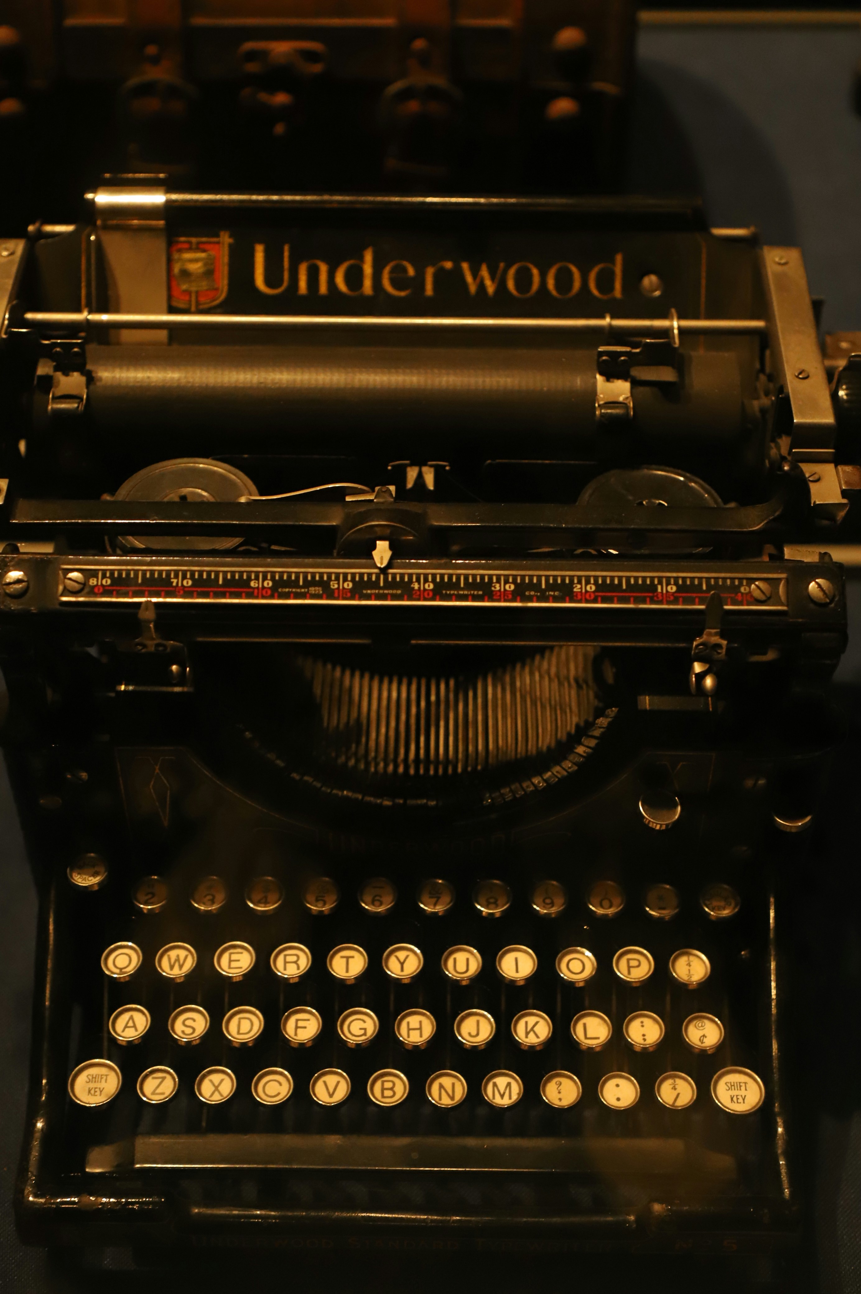 Antique underwood typewriter with visible keys and mechanism.