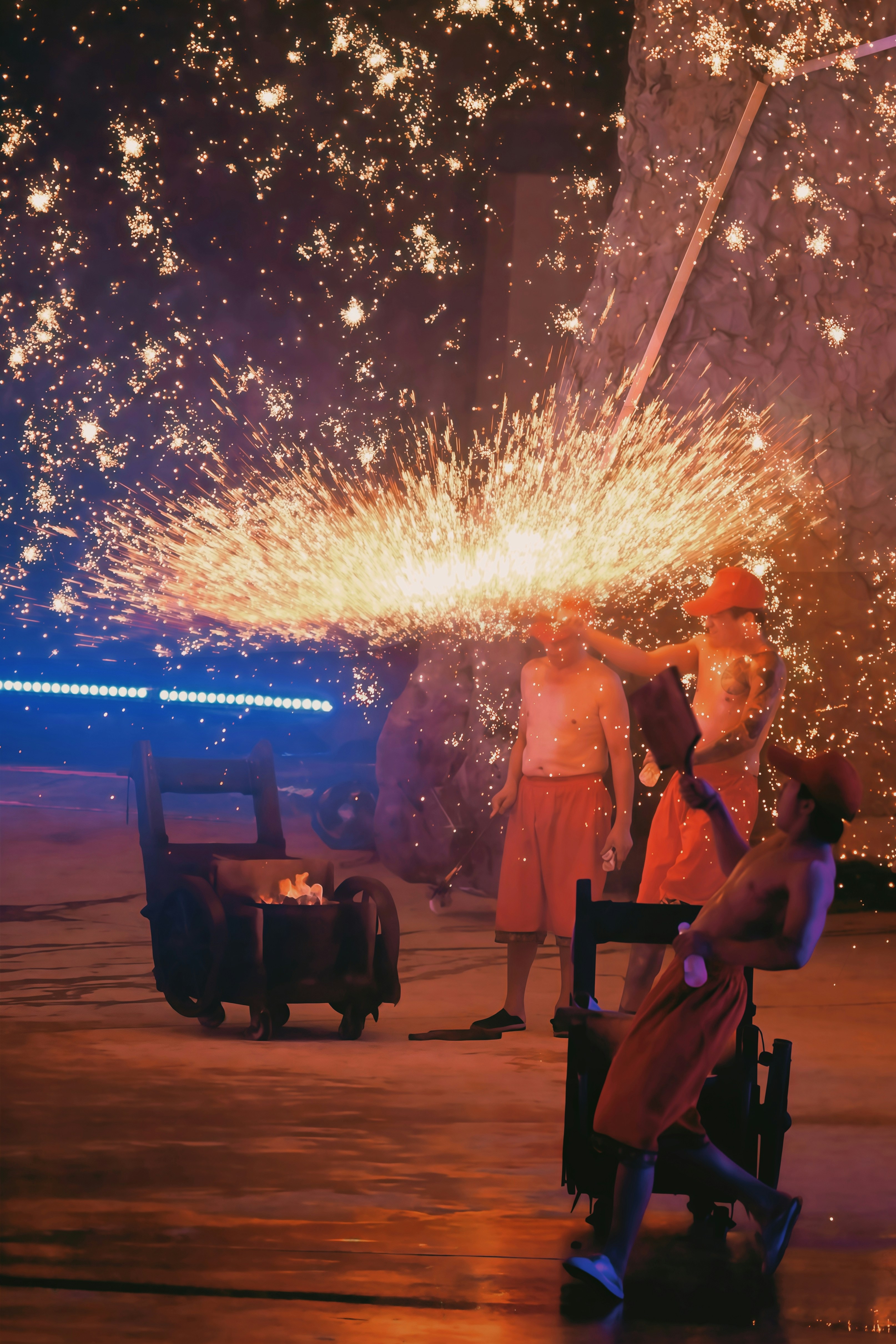 Performers create a shower of sparks during a show.