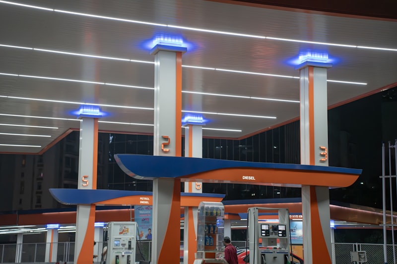 Modern gas station with illuminated fuel pumps