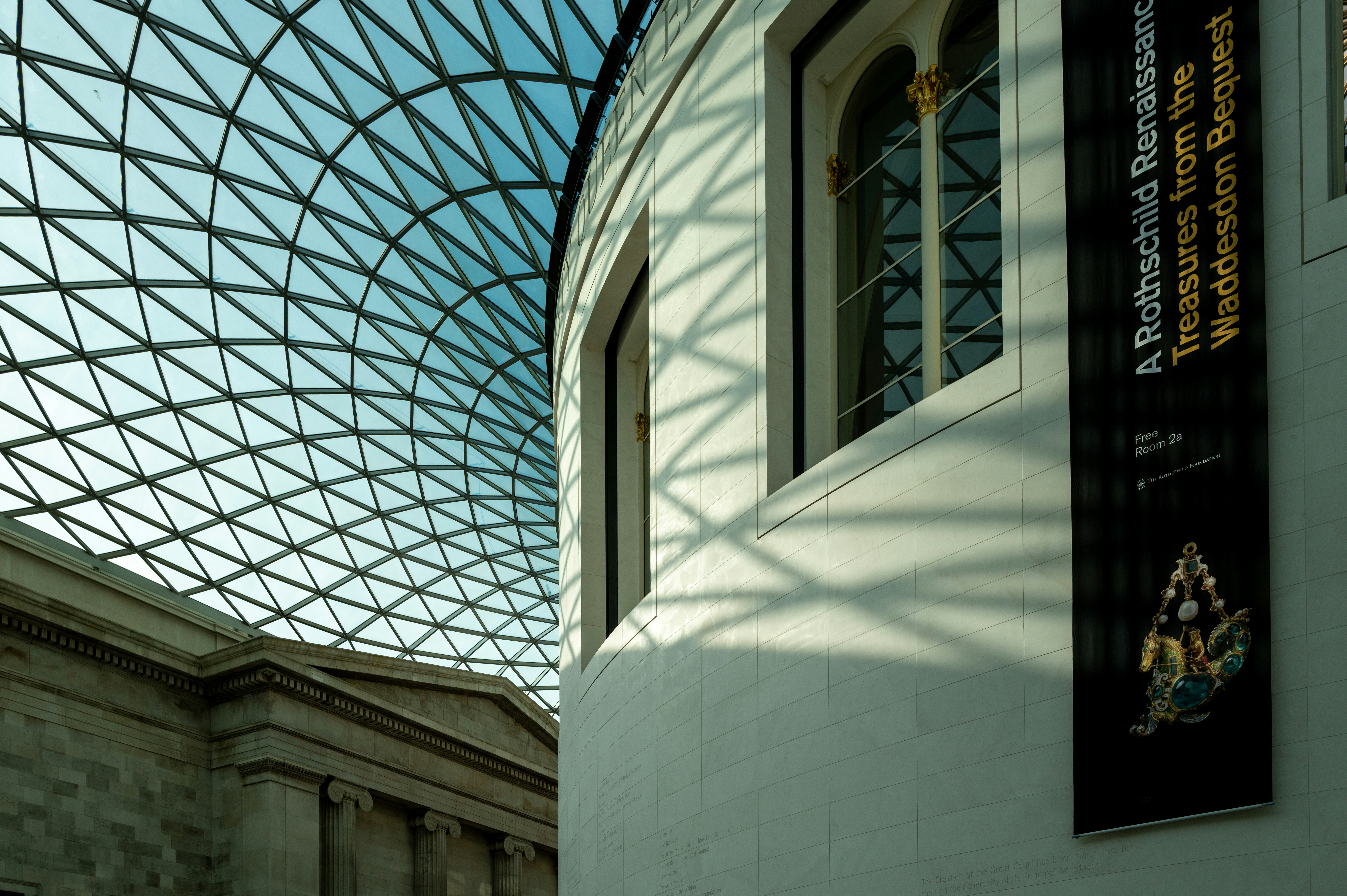 Modern glass roof over historic building architecture