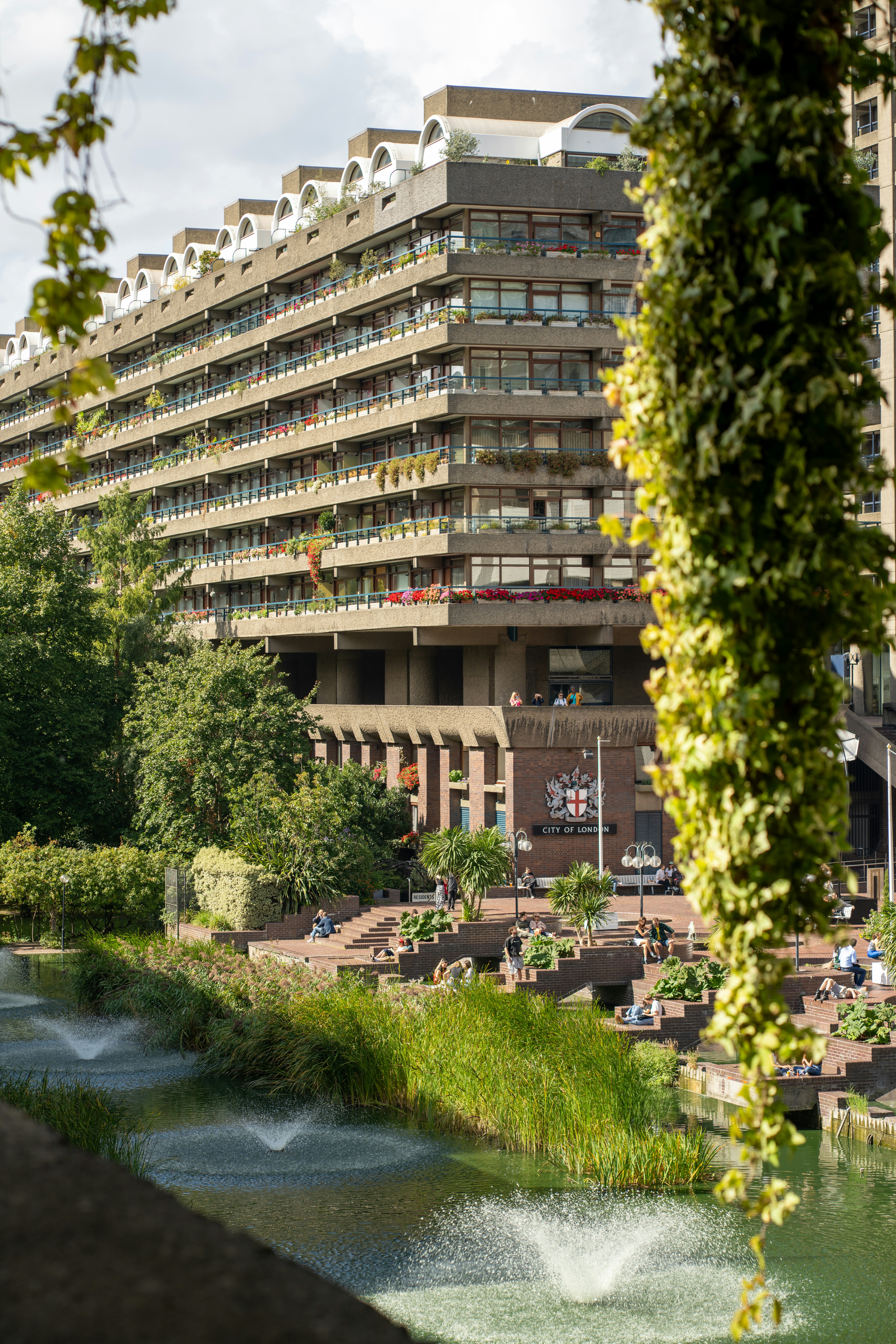 Brutalist architecture building with fountains and greenery