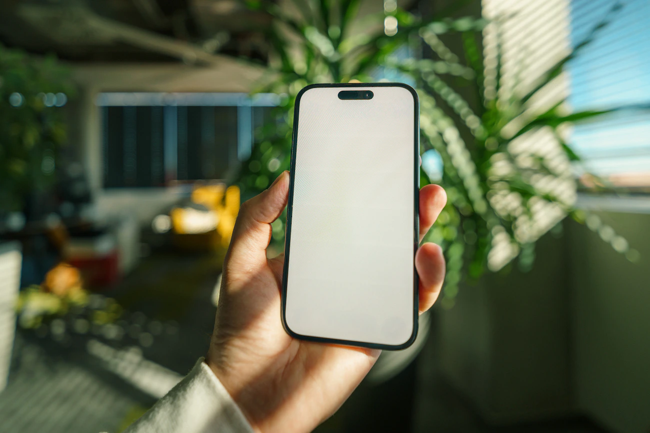 Reading Gurley Leadership Solutions reviews on a smartphone in an office