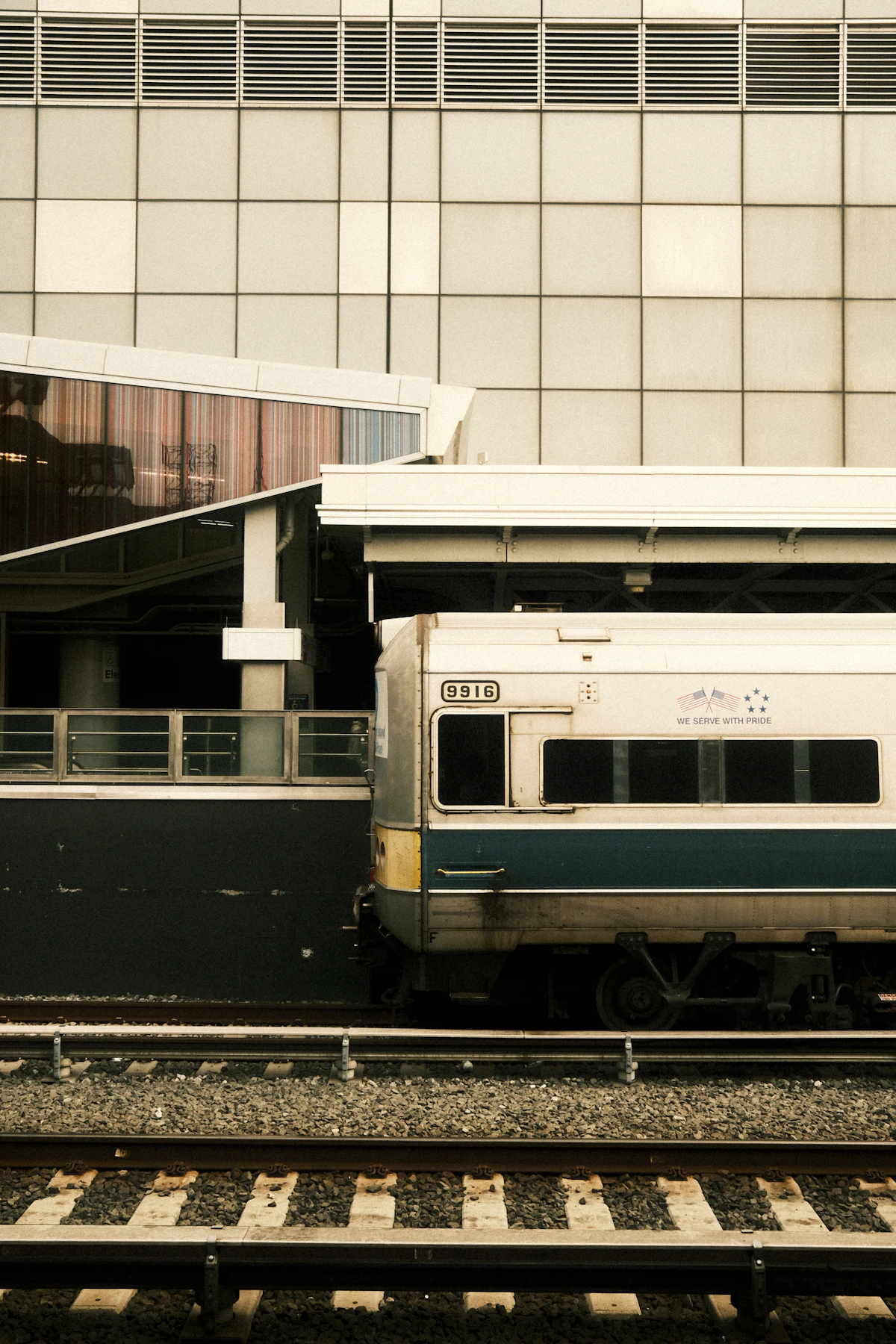 Passengers waiting for a train on a Tokyo station platform