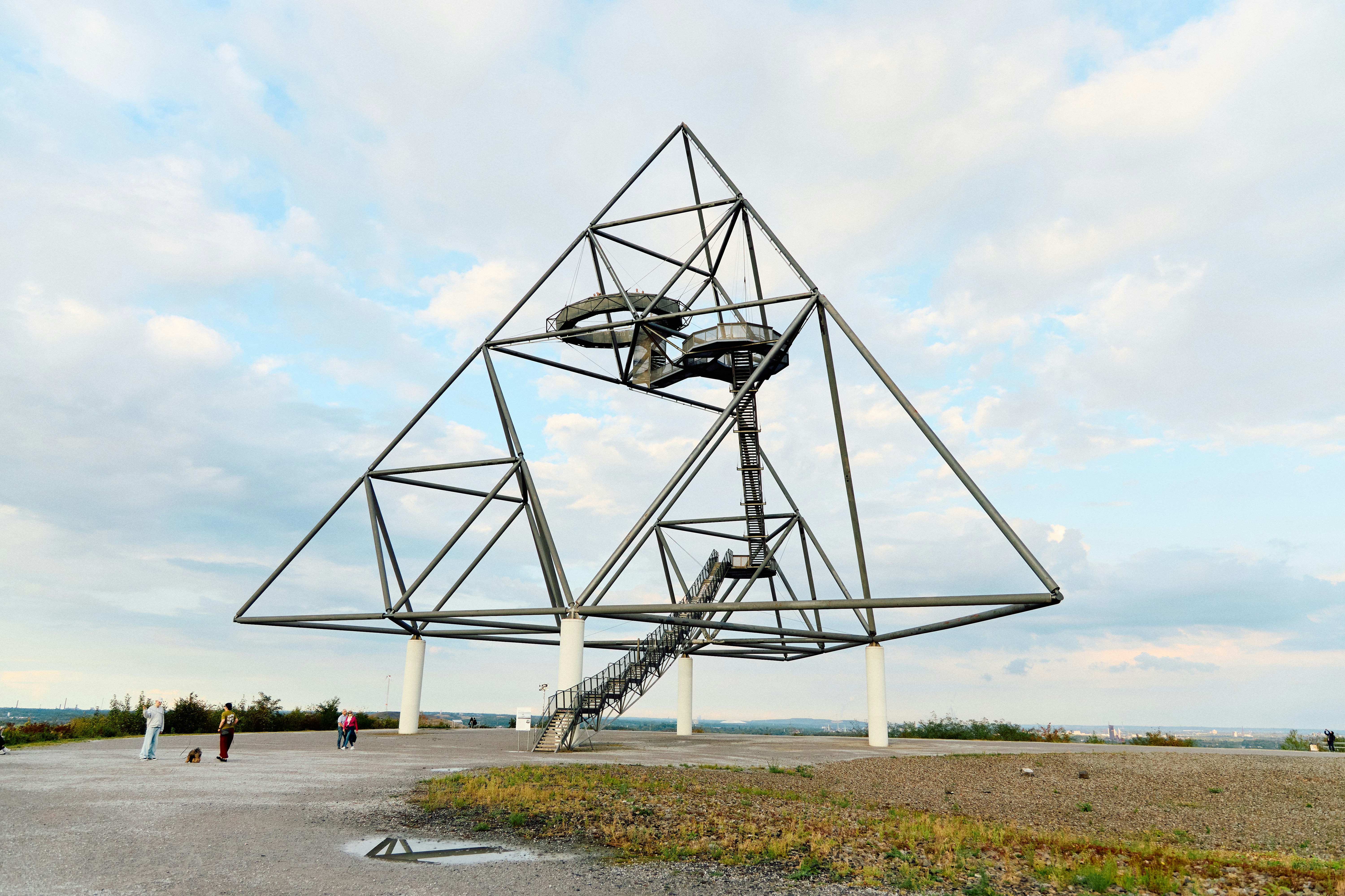 Modern pyramid-shaped observation tower with stairs