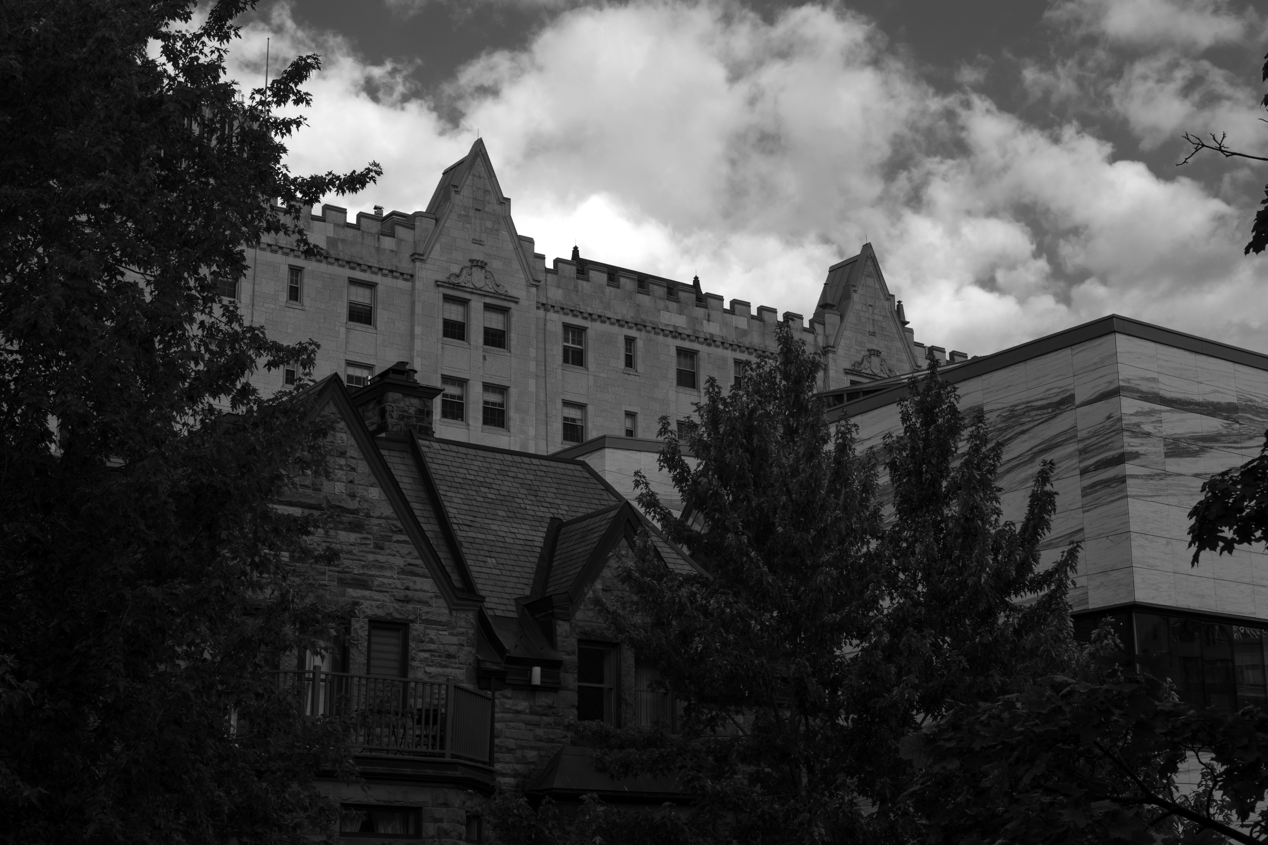 Gothic building with towers against cloudy sky