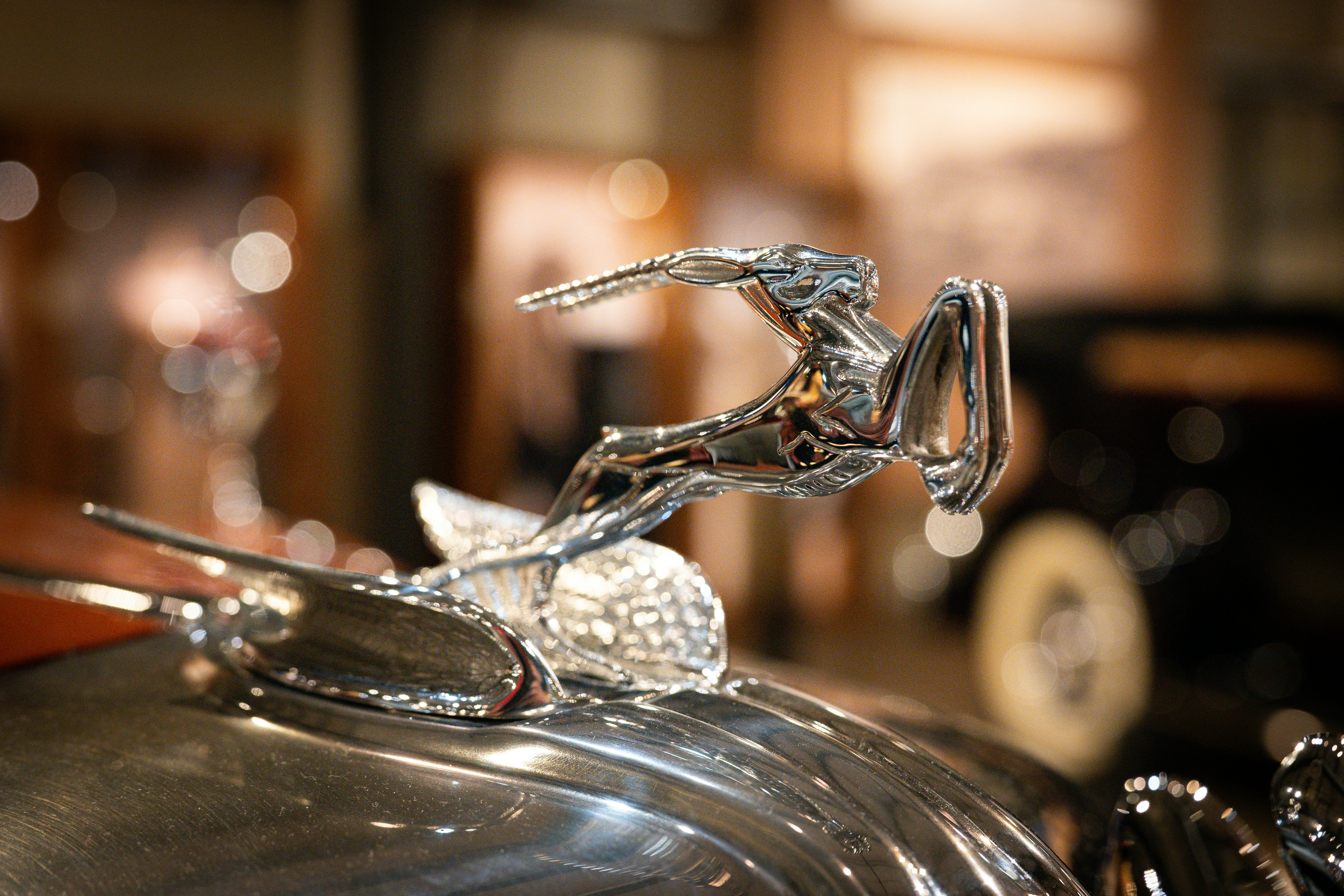 Chrome hood ornament on a vintage car