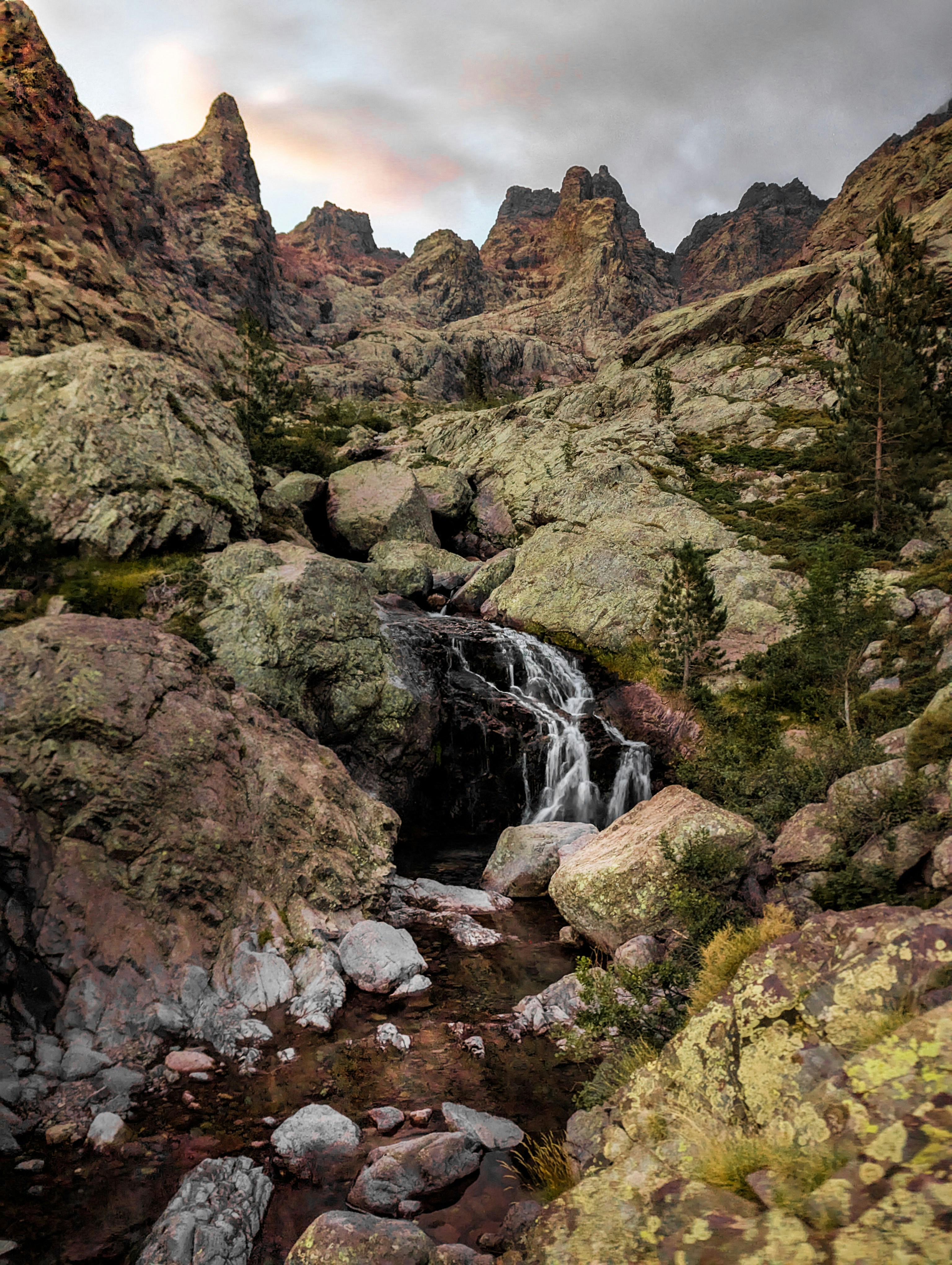 Rocky mountain landscape with a small waterfall