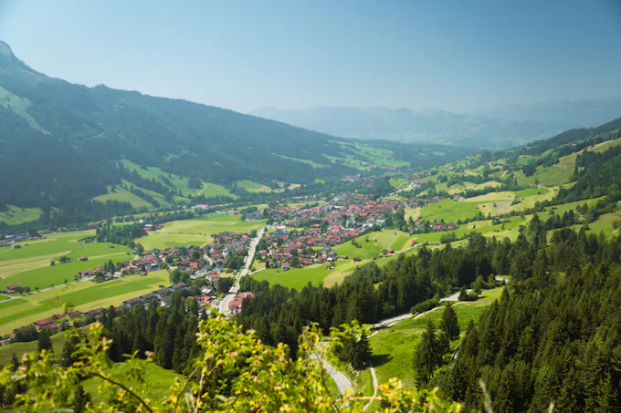 Green valley with a small town and mountains, similar to the quiet, historic setting of Newry, PA