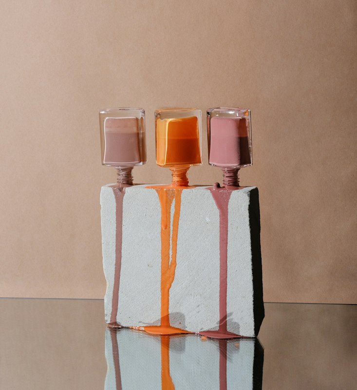 Nail polish bottles in warm tones