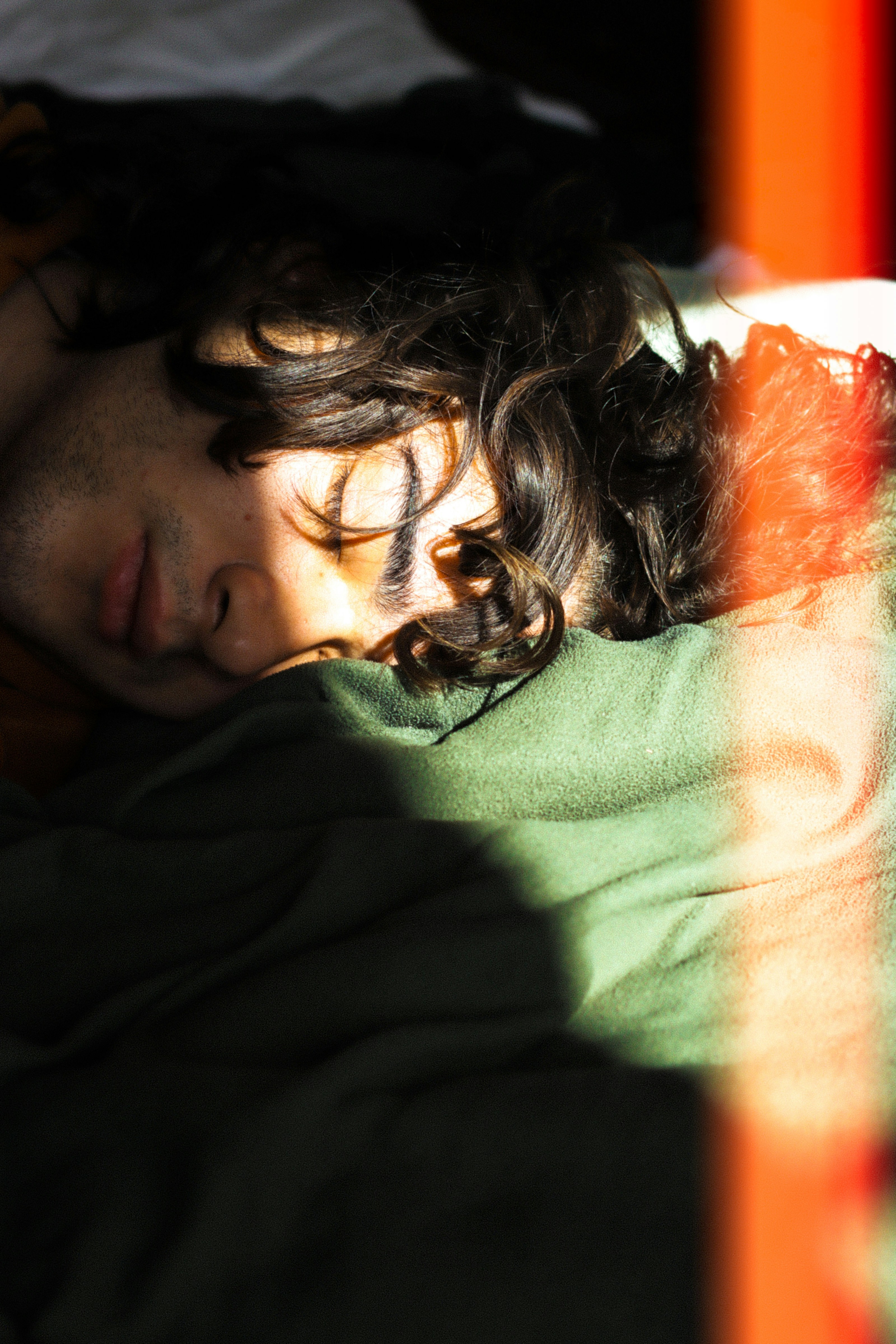 Man sleeping peacefully in sunlight