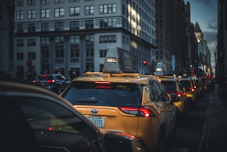 Yellow taxis in city traffic during the day
