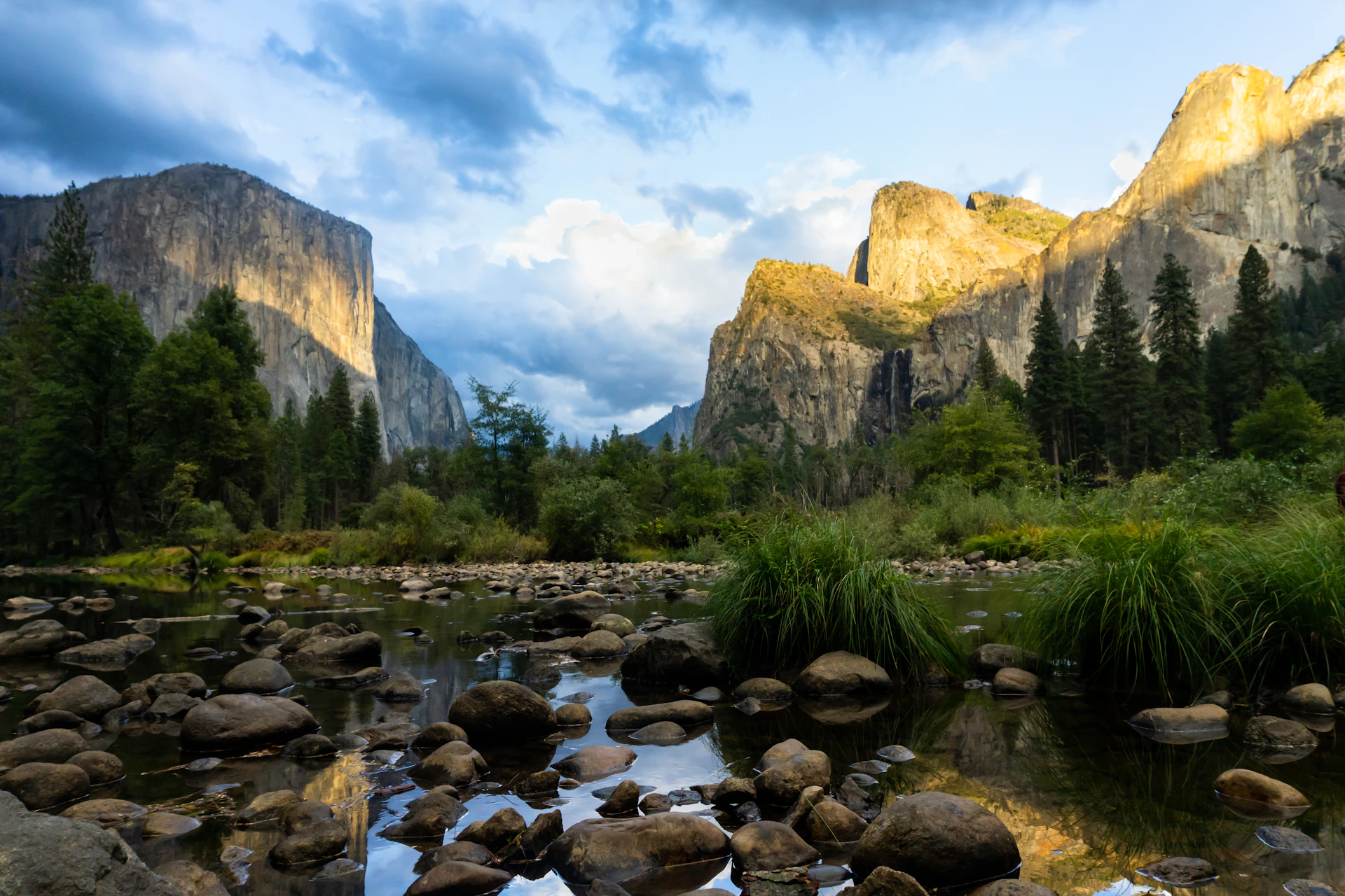 Sunlight illuminates yosemite valley with el capitan and bridalveil fall.