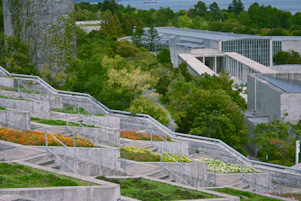 Terraced gardens with modern architecture and lush greenery