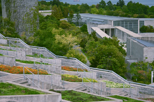Terraced gardens with modern architecture and lush greenery