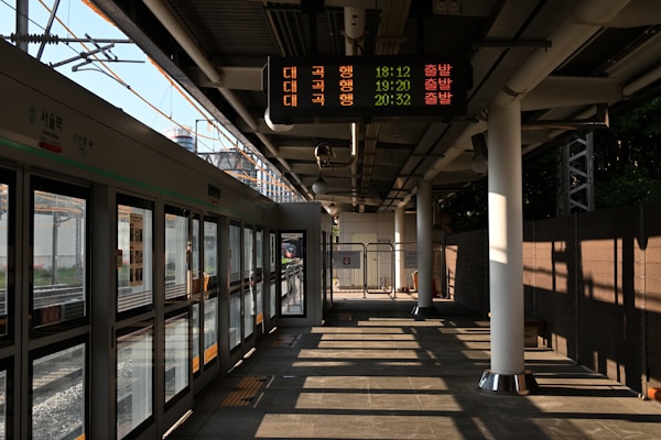 Train station platform with digital display board.