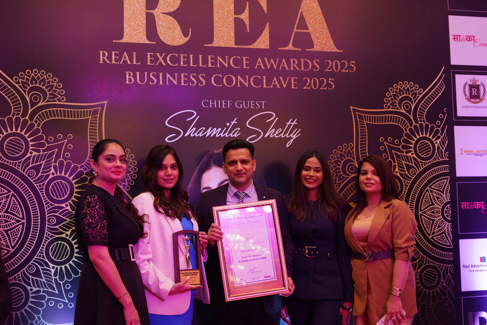 Revolutra team celebrating their industry excellence award