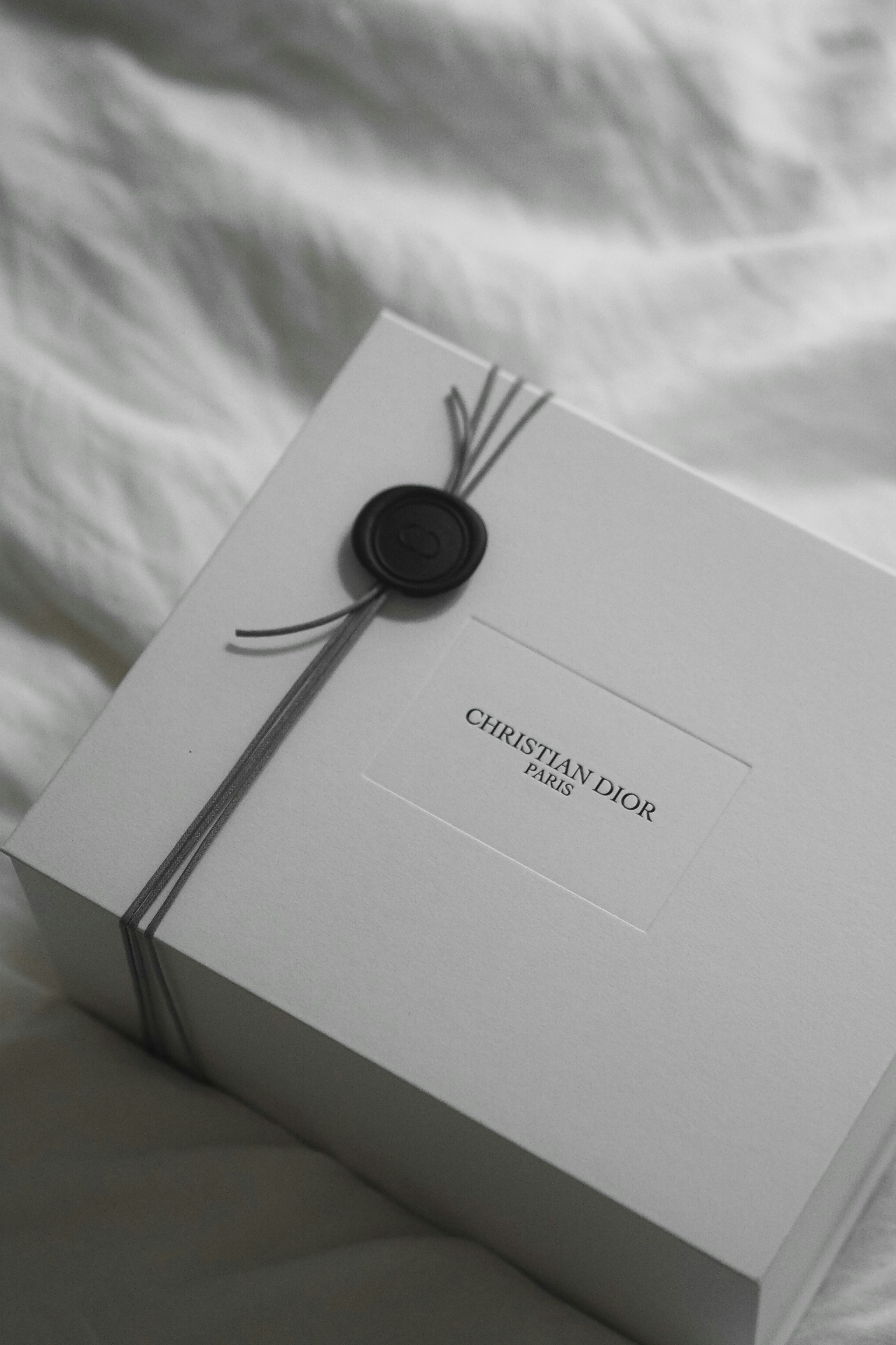 White christian dior gift box with ribbon and wax seal