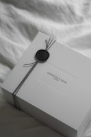 White christian dior gift box with ribbon and wax seal