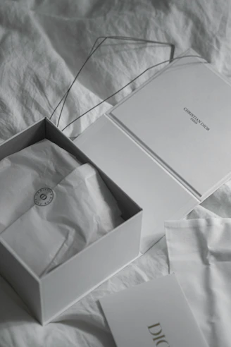 Open white box with dior packaging inside
