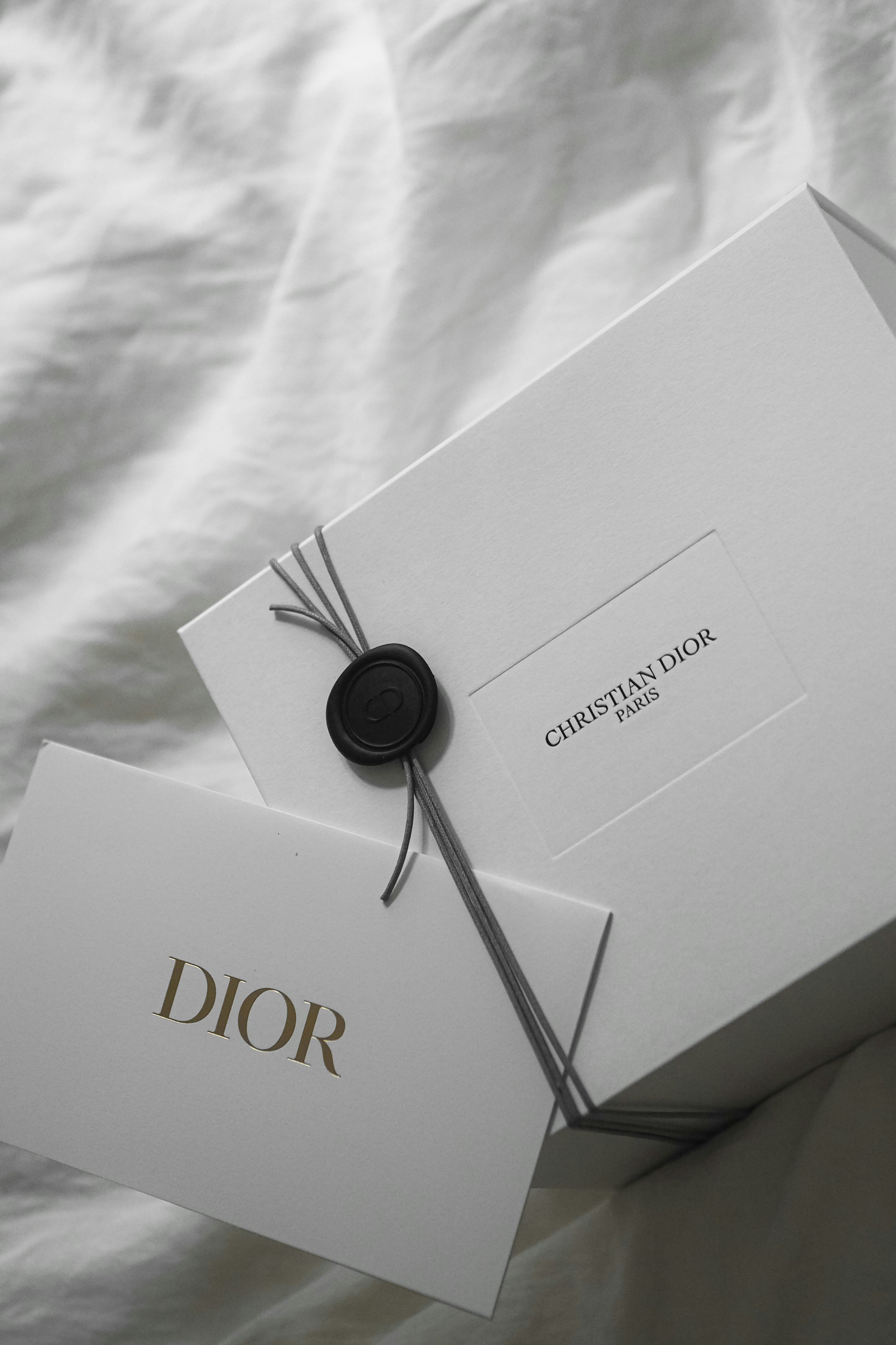 White dior box with wax seal and tag