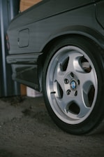 Close-up of a vintage BMW wheel and tire