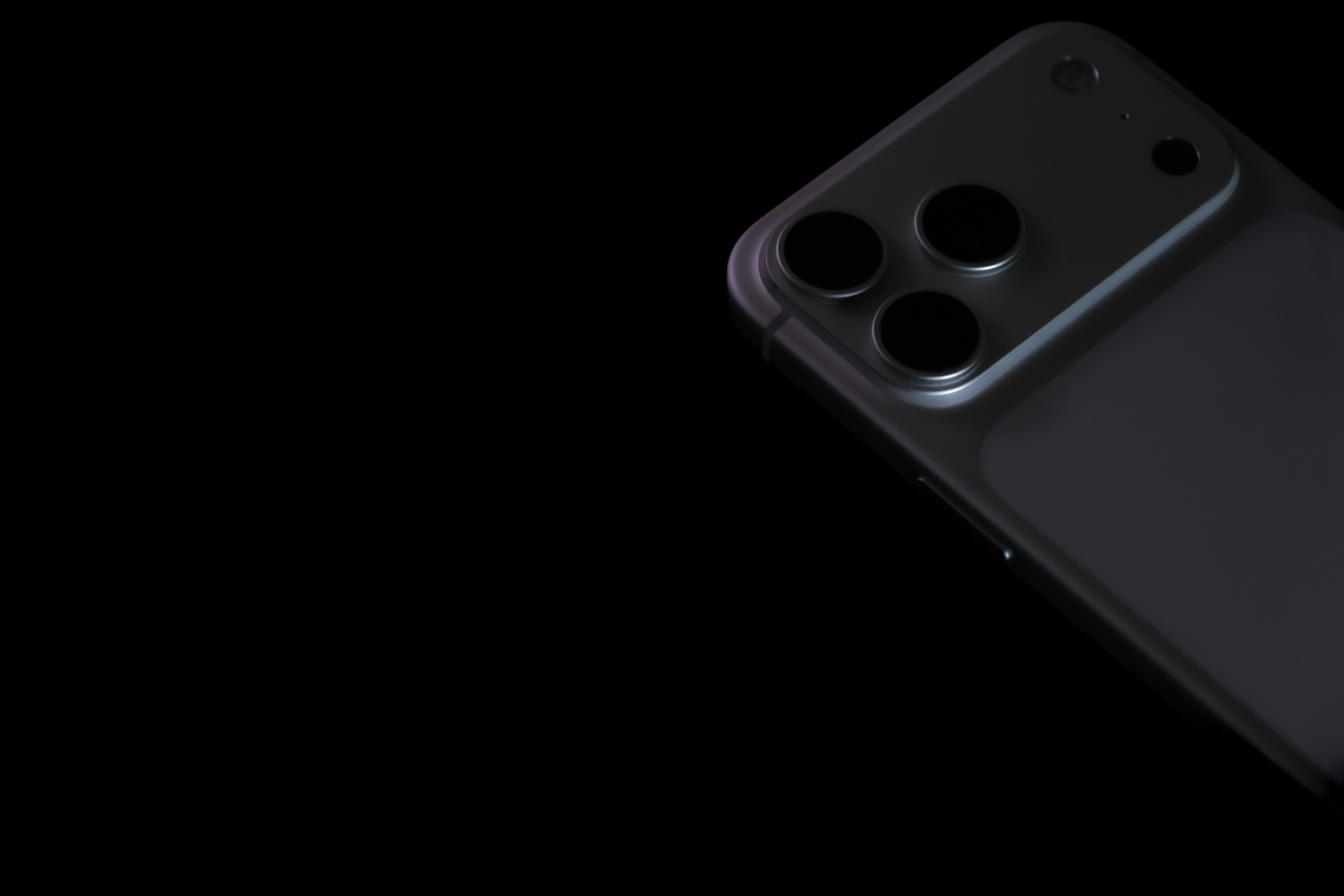 Close-up of a dark smartphone camera array.