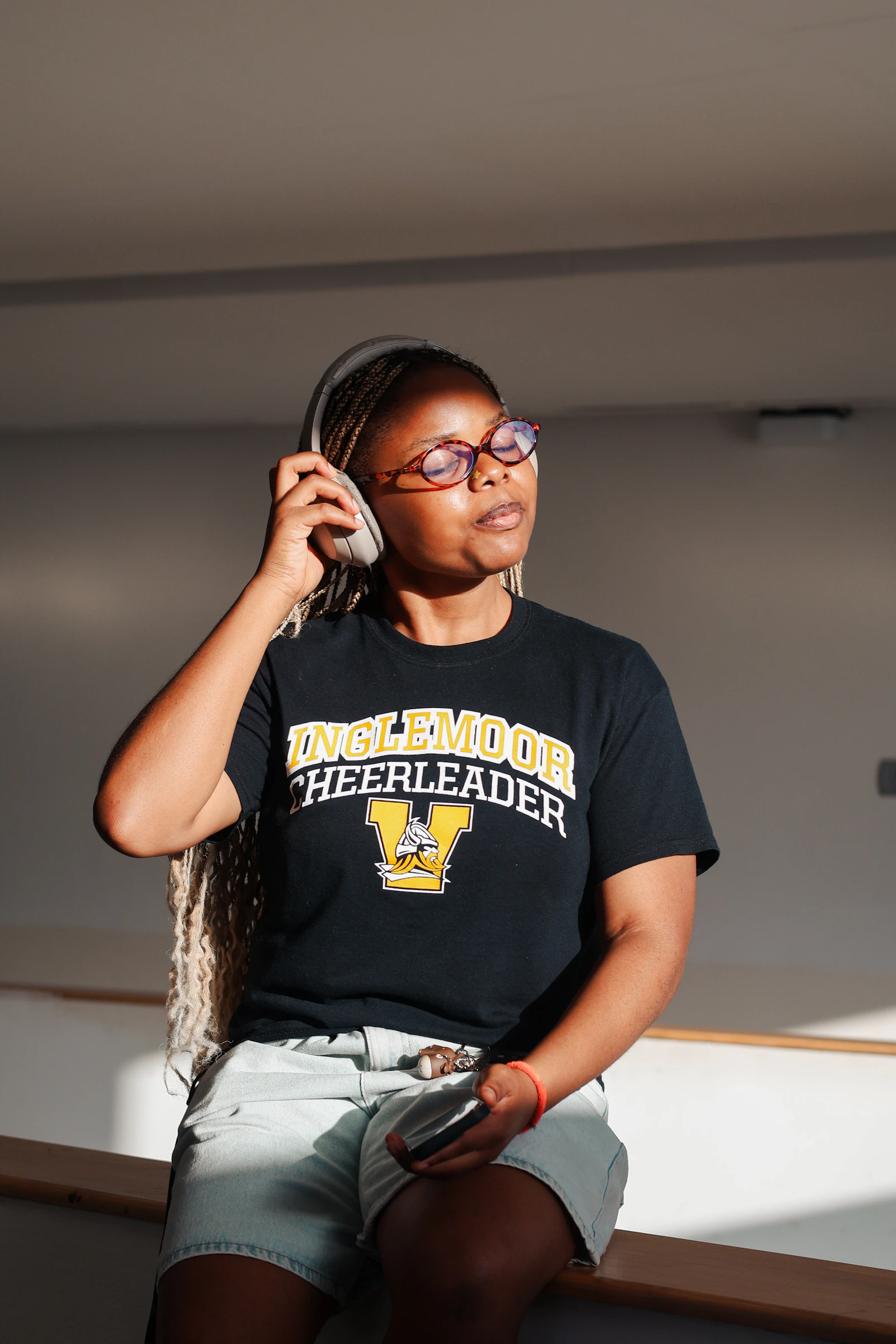 Listener wearing headphones and enjoying a music recording