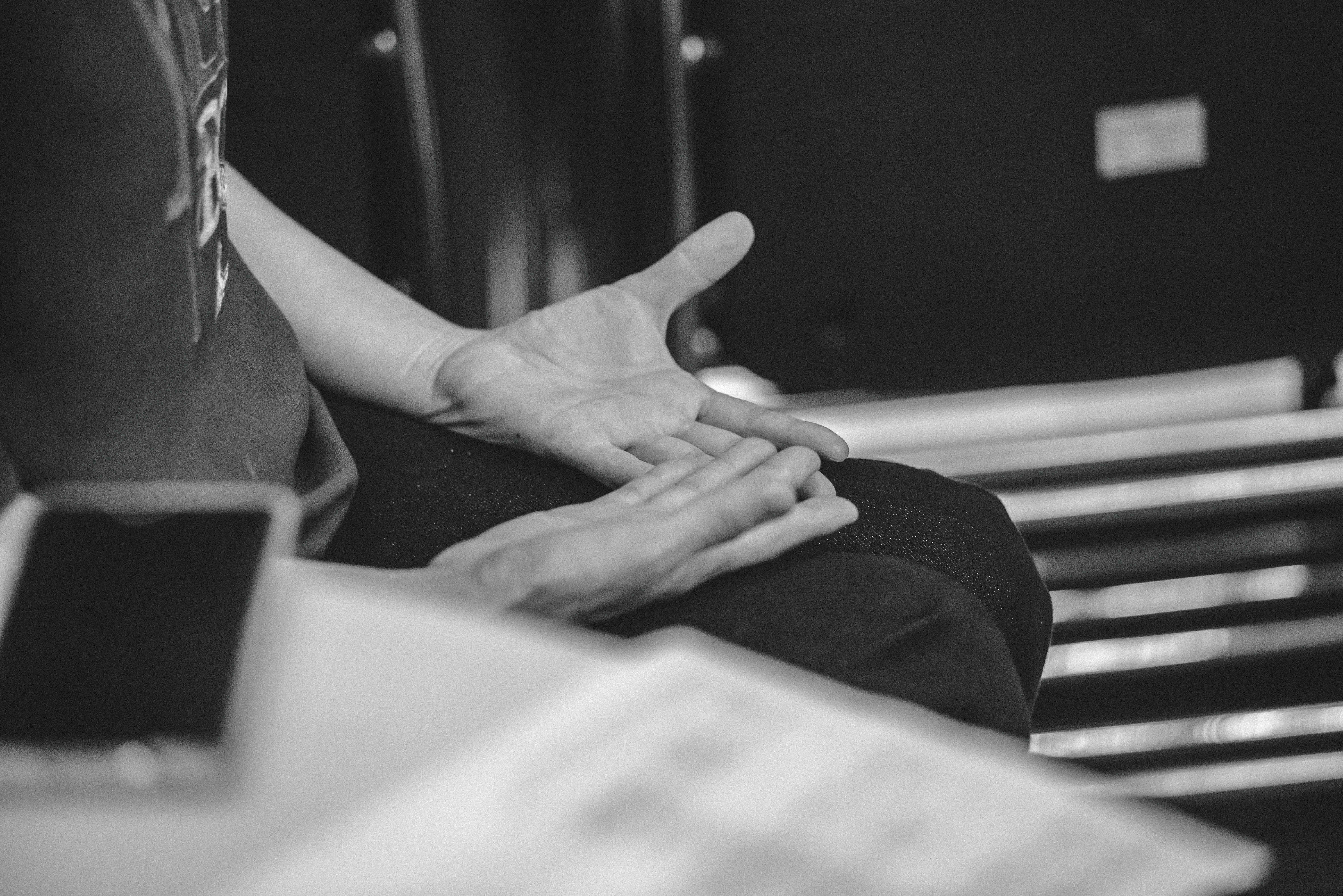 Person gesturing with hands during conversation