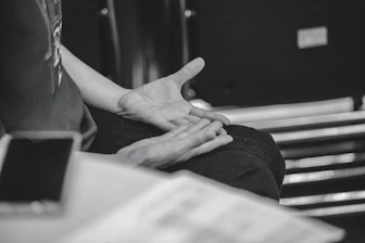 Person gesturing with hands during conversation