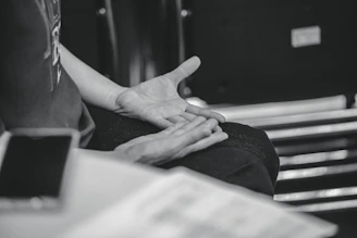 Person gesturing with hands during conversation