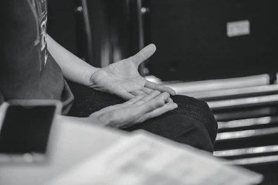 Person gesturing with hands during conversation
