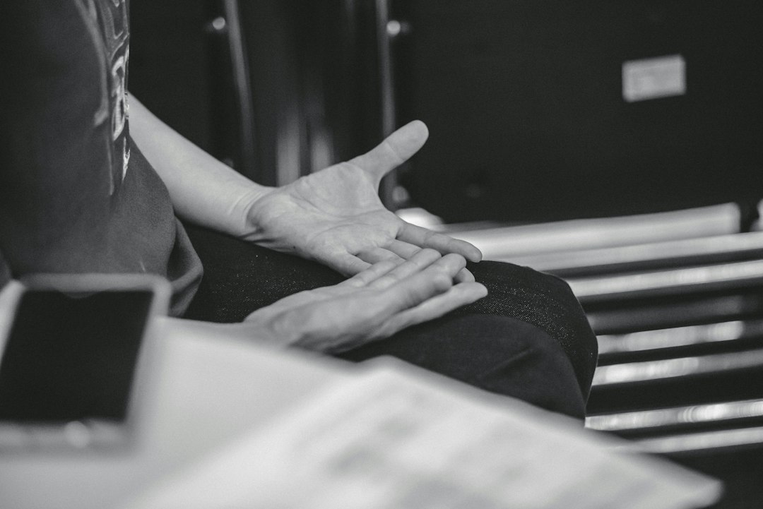 Person gesturing with hands during conversation