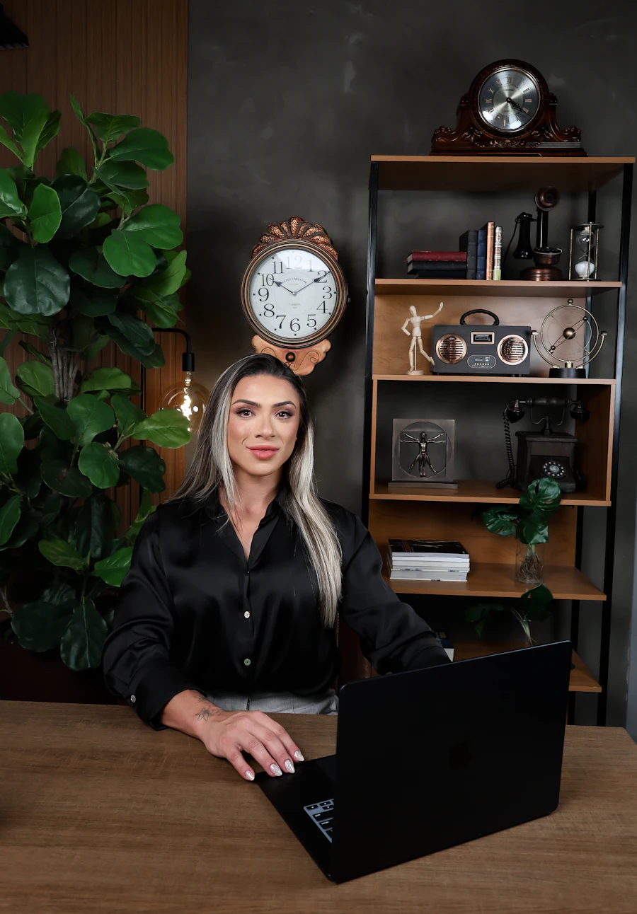 A founder at a home-office desk working on a laptop — one person balancing personal and business responsibilities.