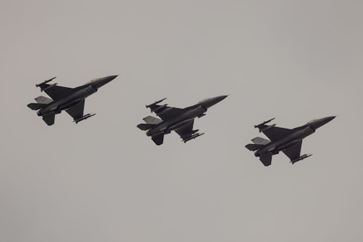 Three fighter jets flying in formation