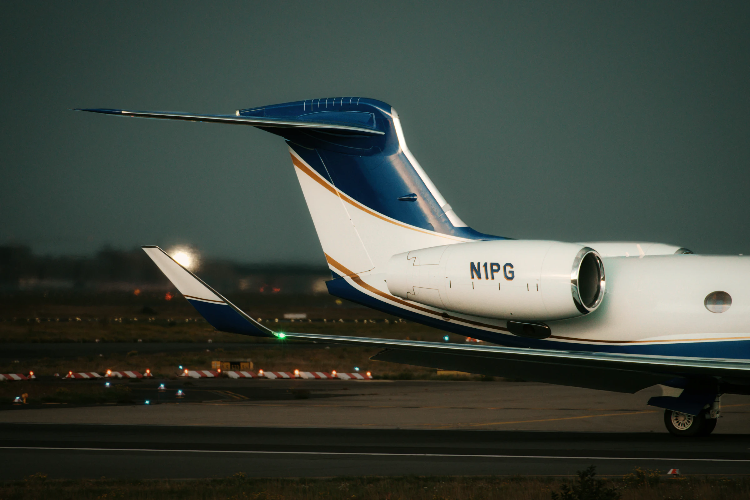 A private jet on the tarmac at dusk