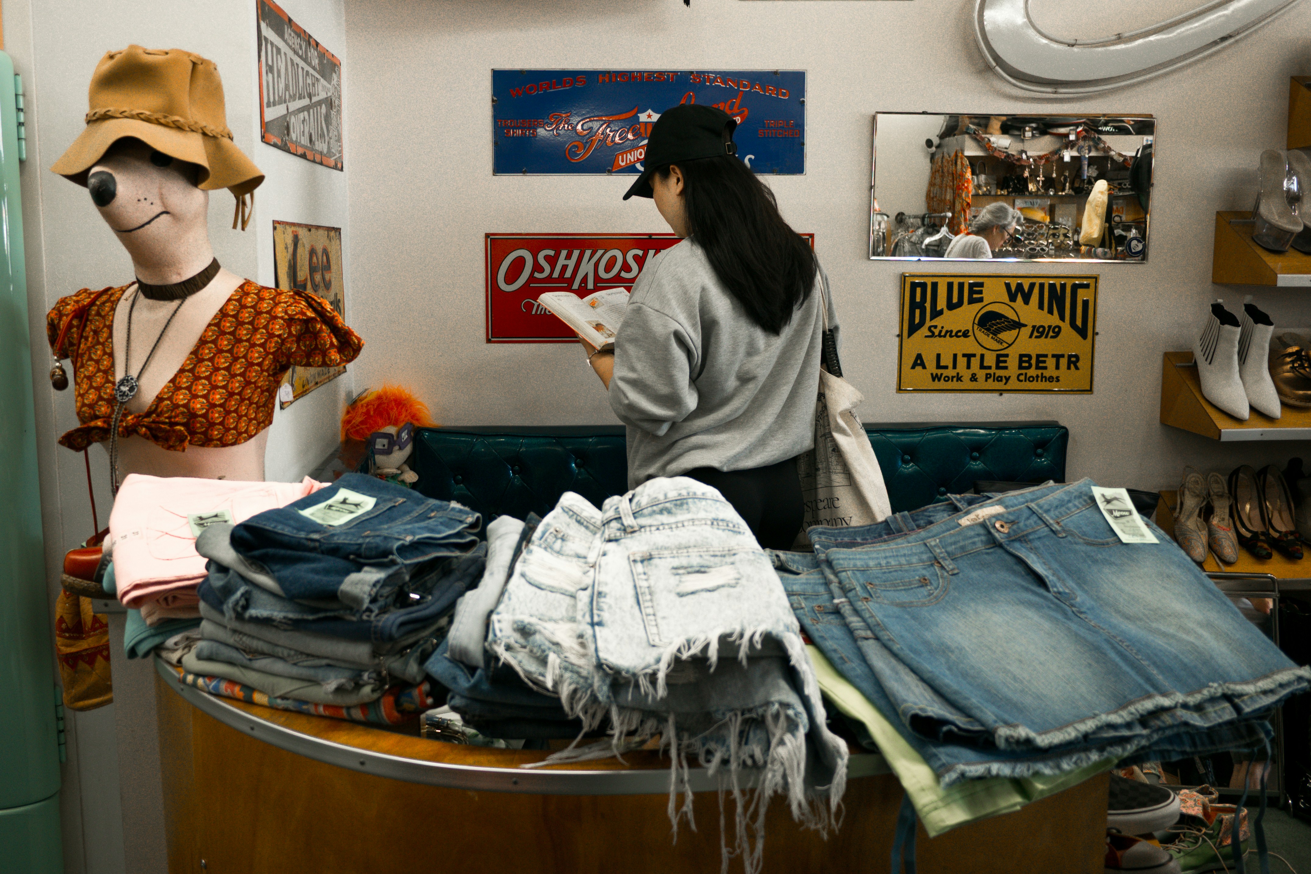 Woman browsing clothes in a vintage store.