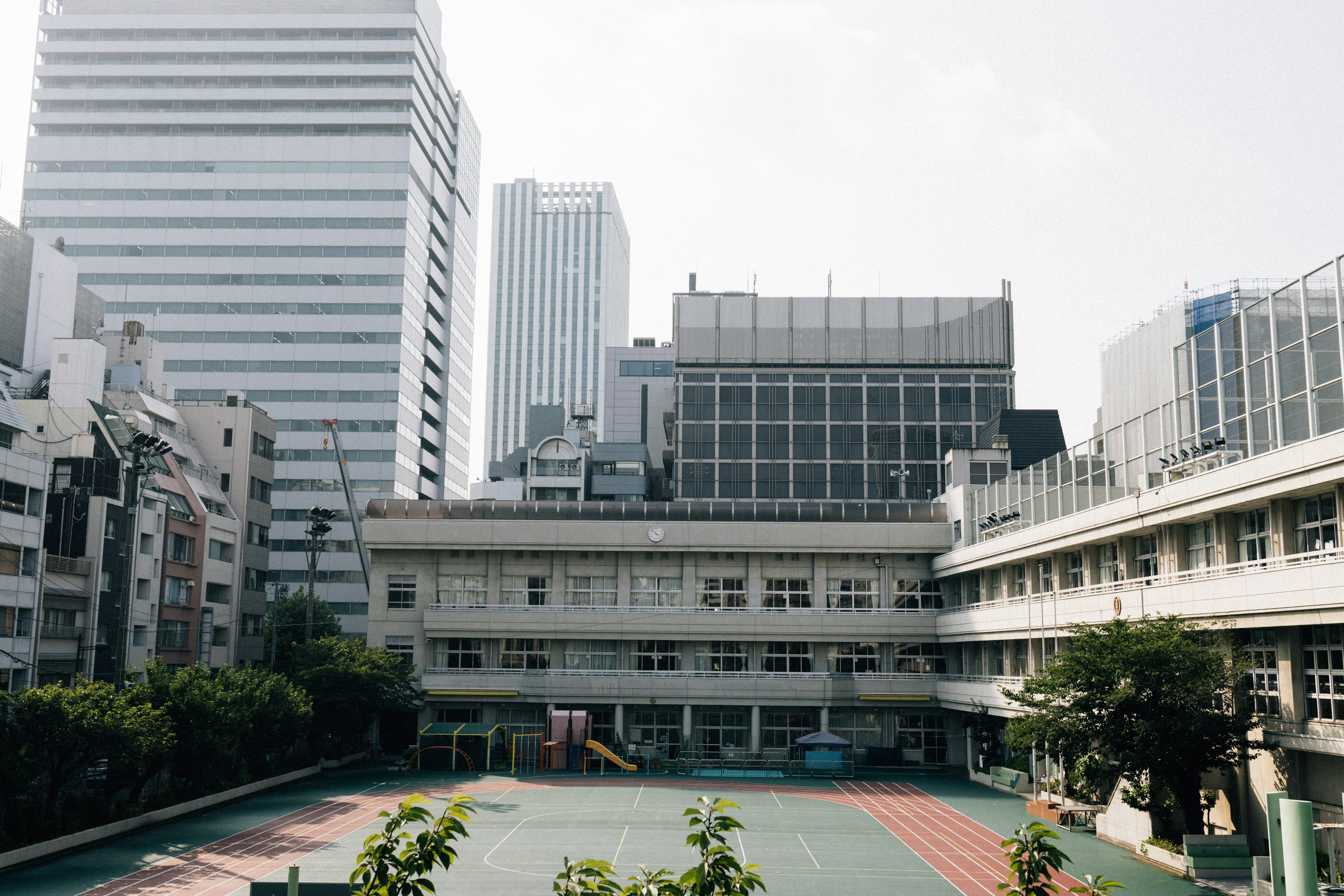 Modern school building with skyscrapers in the background