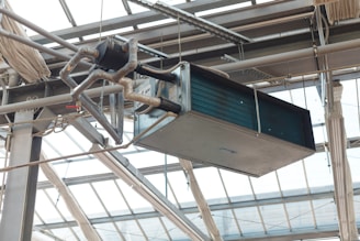Industrial hvac unit hanging from ceiling structure
