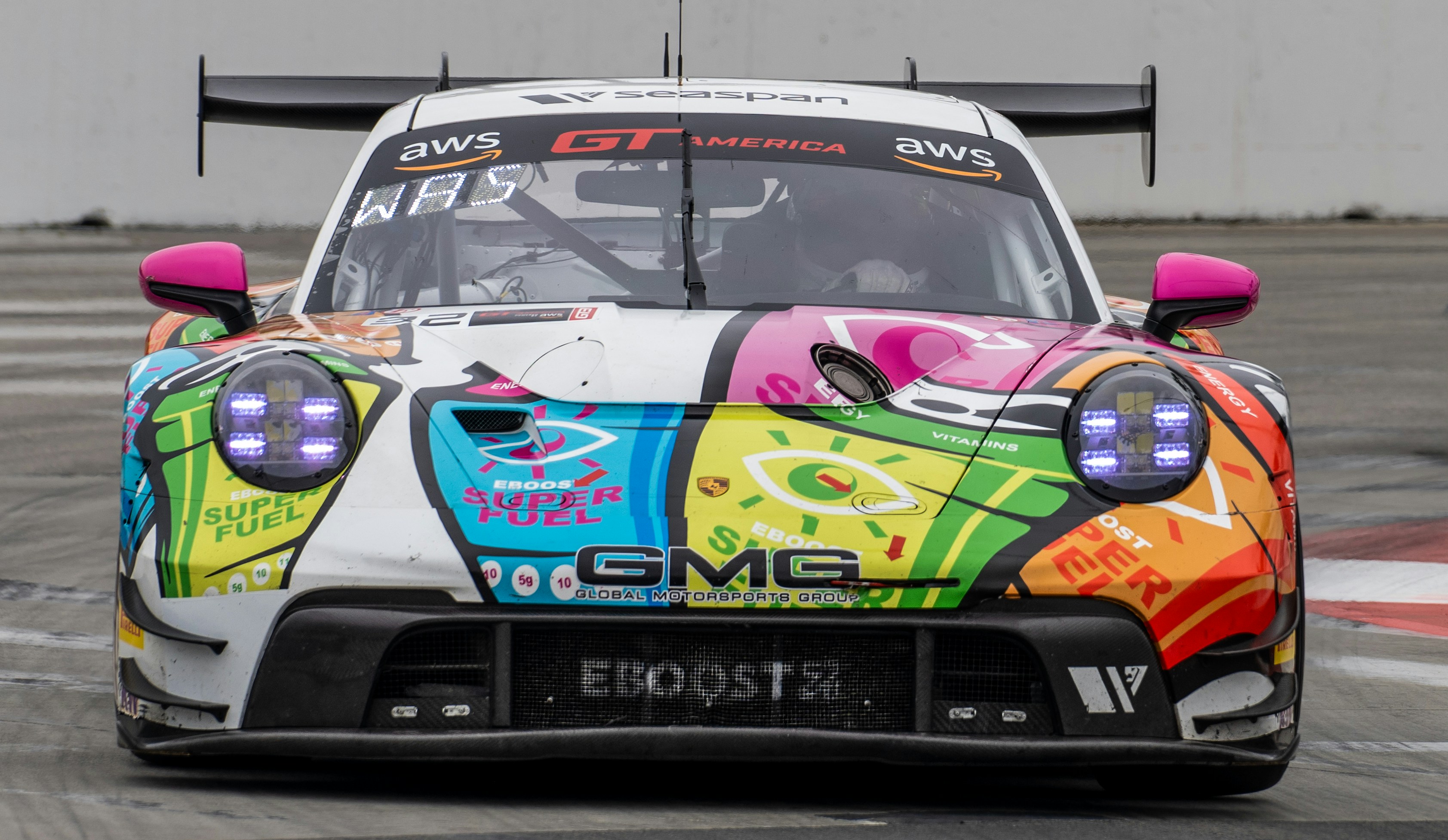 Colorful porsche 911 gt3 race car on track